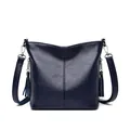 Elegant navy blue pebbled leather crossbody bag for women with side tassel detail - Dark Blue