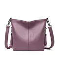 Elegant purple pebbled leather crossbody shoulder bag for women with stylish tassels. - Violet
