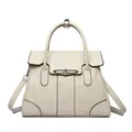Elegant cream faux leather handbag with top handle and adjustable crossbody strap for women - Off White