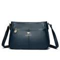 Elegant navy blue pebbled leather crossbody bag with kangaroo logo and large capacity - Blue