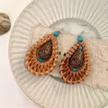 Detail view of bohemian rattan teardrop earrings with turquoise accents and drop beads. - Water Drop Rattan Style (A2769银) / Natural Wood Color