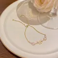 Elegant gold adjustable bracelet with zircon flowers and cat eye butterfly charm - Cat's Eye Butterfly and Floral Style (S744) / Gold