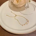 Elegant gold flower bracelet with micro-inlaid zircon and cat eye stone for women jewelry. - Floral Cat's Eye Style (S751) / Gold