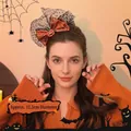 Halloween headband featuring orange spider web bow and pumpkin decoration worn by a model - Orange (F2007橘)
