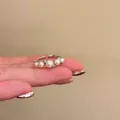 French Baroque style open ring featuring white pearls and silver finish on a finger - J1063 Pearl Style (J1063) / Adjustable Open / Silver