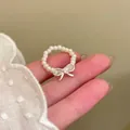 Elegant French Baroque style pearl ring featuring a dainty silver bow accent for women - J1000 Beaded Style (J1000)