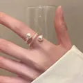 Elegant French style baroque pearl open ring with textured band shown on hand - J937 Double Pearl Style (J937)