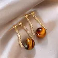 Elegant Maillard style acrylic resin pendant earrings with gold-tone textured U-shape design - U-Shaped Textured Metal Pendant Acrylic Ball (A2711)