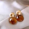 Elegant Maillard style dangle earrings featuring gold metal balls and amber resin discs - Metal Ball Amber Texture Disk Earrings (A1358)