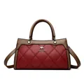 Elegant maroon diamond quilted handbag with stylish brown handles and kangaroo logo - Red