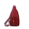 Elegant red leather sling bag for women featuring a stylish patterned wide shoulder strap - Red