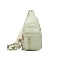 Chic sage green women's sling bag featuring a wide patterned strap and gold hardware - Green