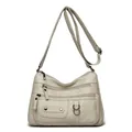 Elegant cream soft leather crossbody bag featuring multiple functional zipper pockets. - Off-White (446-144)