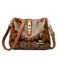Vintage brown floral embossed crossbody bag with golden kangaroo emblem - Yellow