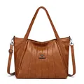 Grote bruine leren shopper met elegant geplooid ontwerp en gevlochten handvatten - Geel