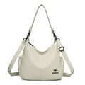 Elegant cream white textured leather hobo handbag featuring an adjustable crossbody strap - Off White