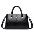 Bolso de mano elegante en cuero sintético negro con asas trenzadas y correa - Negro