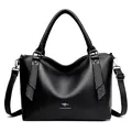 Sophisticated black pebbled leather handbag with rhinestone details and adjustable strap - Black