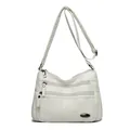 Stylish white multi-pocket crossbody bag for women, featuring a lightweight and durable design. - Off White