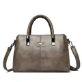 Elegante bolso de mano en cuero texturizado con asas trenzadas y bandolera - Gris oscuro