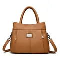 Retro brown leather women's handbag with pebble texture and adjustable crossbody strap. - Yellow