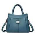 Retro blue pebbled leather handbag with top handles and adjustable shoulder strap - Blue
