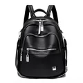 Fashionable black soft leather backpack with multi-zipper compartments and silver hardware - Black
