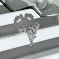 Macro detail of elegant silver open ring with purple crystal flowers and fringe design - 3D Flower Tassel Style