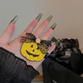 Close-up of a glittery Halloween pumpkin hair clip featuring a delicate black lace bow - Yellow Sequin Rose Style (F2006 Yellow)