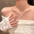 Elegant double-layered silver necklace with a heart pendant shown on a female model - Double Layer Heart Style (X1839 Silver)