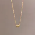 Elegant 18K gold-plated titanium steel necklace featuring a textured cylinder pendant - Waist Cylinder Style (B029) / Gold