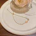 Elegant gold-tone adjustable bracelet with oval cat eye stone and zirconia accents - Oval Cat's Eye Stone Style (S749) / Gold