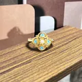 Elegante anillo vintage bañado en oro con diseño floral de esmalte azul y perla central - Estilo Perla Flor de Cruz Azul (59号开口戒指)