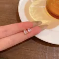 Exquisite emerald cut zircon stud earrings in a minimalist gold-plated setting - Rectangle Style (E6418)