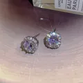 Elegant square halo stud earrings featuring a brilliant round zircon in a polished silver finish. - Square Halo Style / Silver
