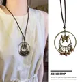 Detail view of retro Zen style long butterfly feather necklace with Bohemian pendant - Bohemian Butterfly Style (X1558 Brown B) / Brown