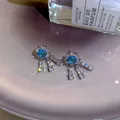 Elegant silver-toned long tassel earrings featuring sparkling blue and clear zircon stones - Sky Blue Tassel Style