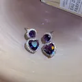 Elegant purple heart-shaped zircon stud earrings featuring a sparkling silver finish - Purple Heart Style