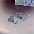 Elegant silver-tone stud earrings with zircon flower and opalescent cat eye stone beads - Cat Eye Petal Style