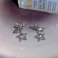 Elegant silver bow and sparkling star drop earrings with premium cubic zirconia - Bow Star Dangle Style