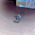Exquisite silver crescent moon stud earring with a central sparkling blue stone - Moon Blue Zircon Style