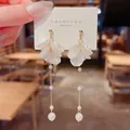 Detailed view of elegant white petal tassel earrings with delicate white pearls - Korean Translucent Petal Tassel Style (E1259金)