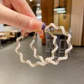 Elegant gold twisted hoop earrings with white pearl accents for a vintage chic look - Gold Twist Pearl Hoop Style (E775金)
