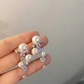 Elegant silver earrings with layered pearls and sparkling crystals in a tassel design - Multi-Pearl Zirconia Tassel Style (A259银)