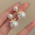 Elegant double white pearl stud earrings with a sleek golden bar for women's fashion - Double Pearl Bar Simple Style (A1583金)