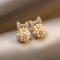 Elegant golden bow earrings with clustered pearl ball design for a chic look. - Bow Pearl Ball Vintage Style (E6471金)