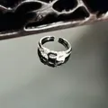 Elegant silver-toned snake ring with micro-pave crystals on dark reflective surface. - Irregular Chain Style (5号)