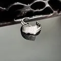 Close-up of silver-toned irregular ring with pave cubic zirconia detailing. - Irregular Tiered Style (8号)