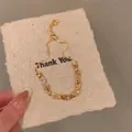 Adjustable gold bracelet with vibrant multicolor cubic zirconia in a refined design. - Colored Zirconia Adjustable Style (S698) / Gold