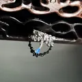 Close-up macro detail of silver lava-style ring with a vibrant blue teardrop gemstone. - Blue Teardrop Lava Style (11号)